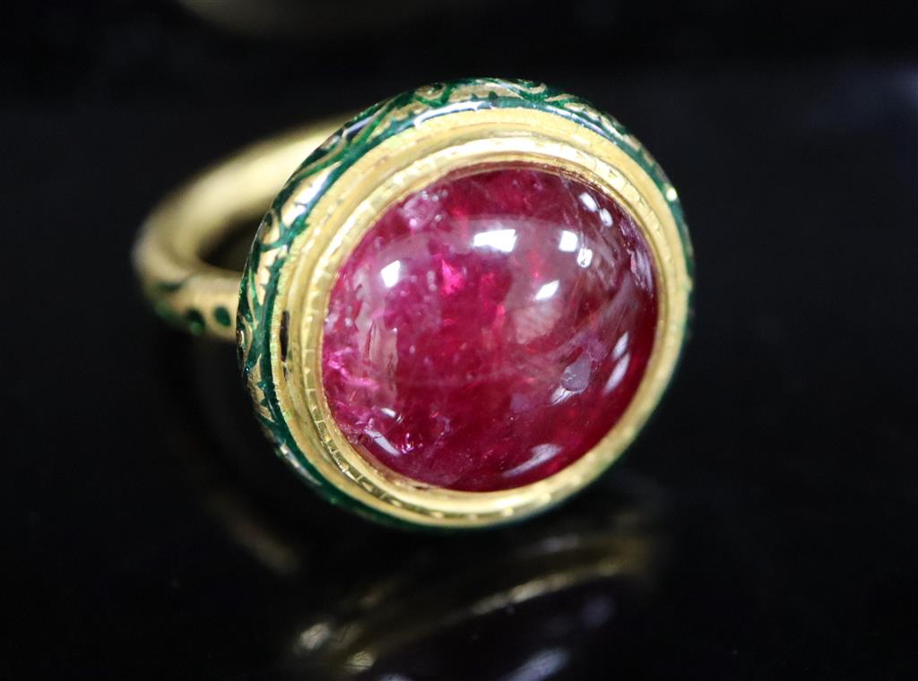 An antique Mogul gold, green enamel and cabochon natural red spinel set ring, size K.